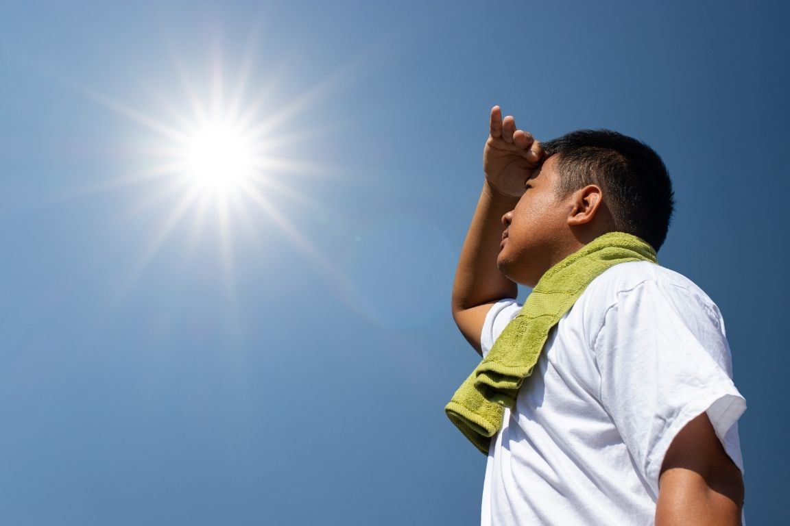 Child in the sun looking up